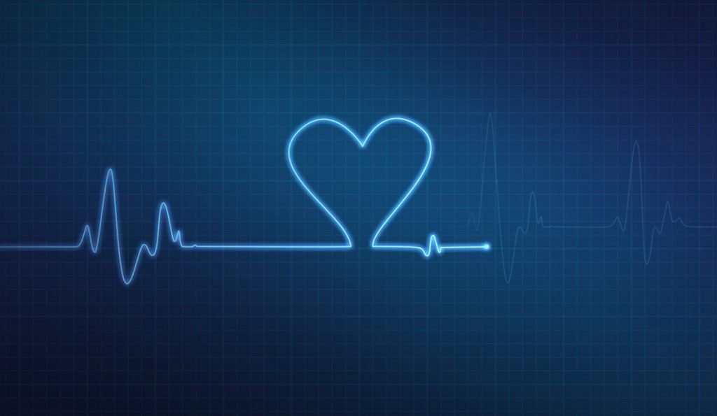 Heart-shaped blip on a medical heart monitor. Deposit photos