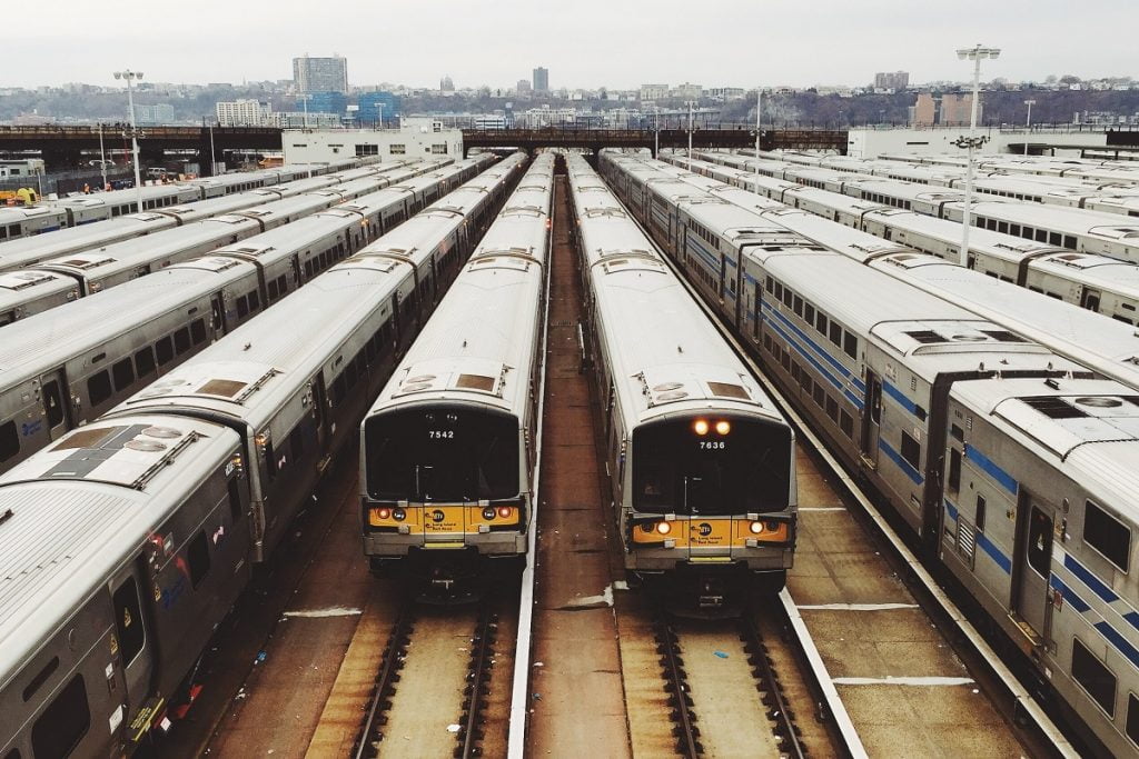 An illustrative photo of trains. Photo by Maxim Melnikov on Unsplash